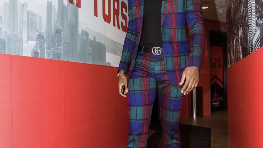 Serge Ibaka walking out of Toronto raptors tunnel in custom empire suit